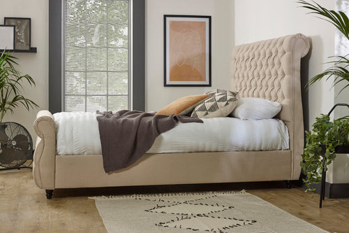 Beige buttoned sleigh bed with scrolled headboard and footboard